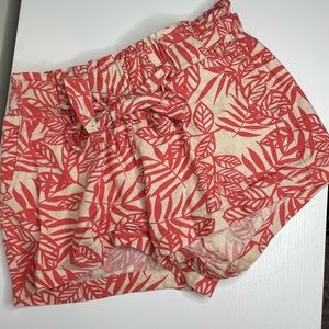 Orange and cream palm leaf print shorts